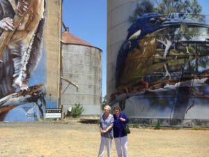 Bev and Judy in front of the painted silos in Rochester